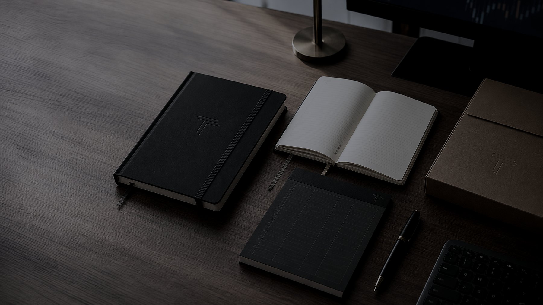 Trade Desk Co. journal, notepad, and packaging on a working desk